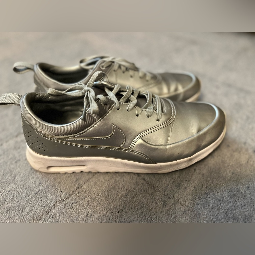 Size 10 women’s silver Nikes.